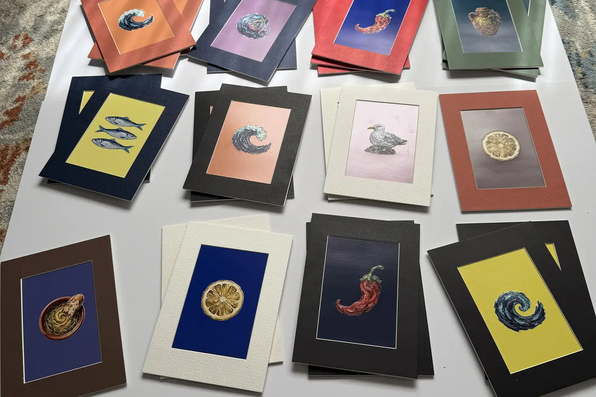Dozens of mini art frames in different pattern and colour combinations laid out in sunlight