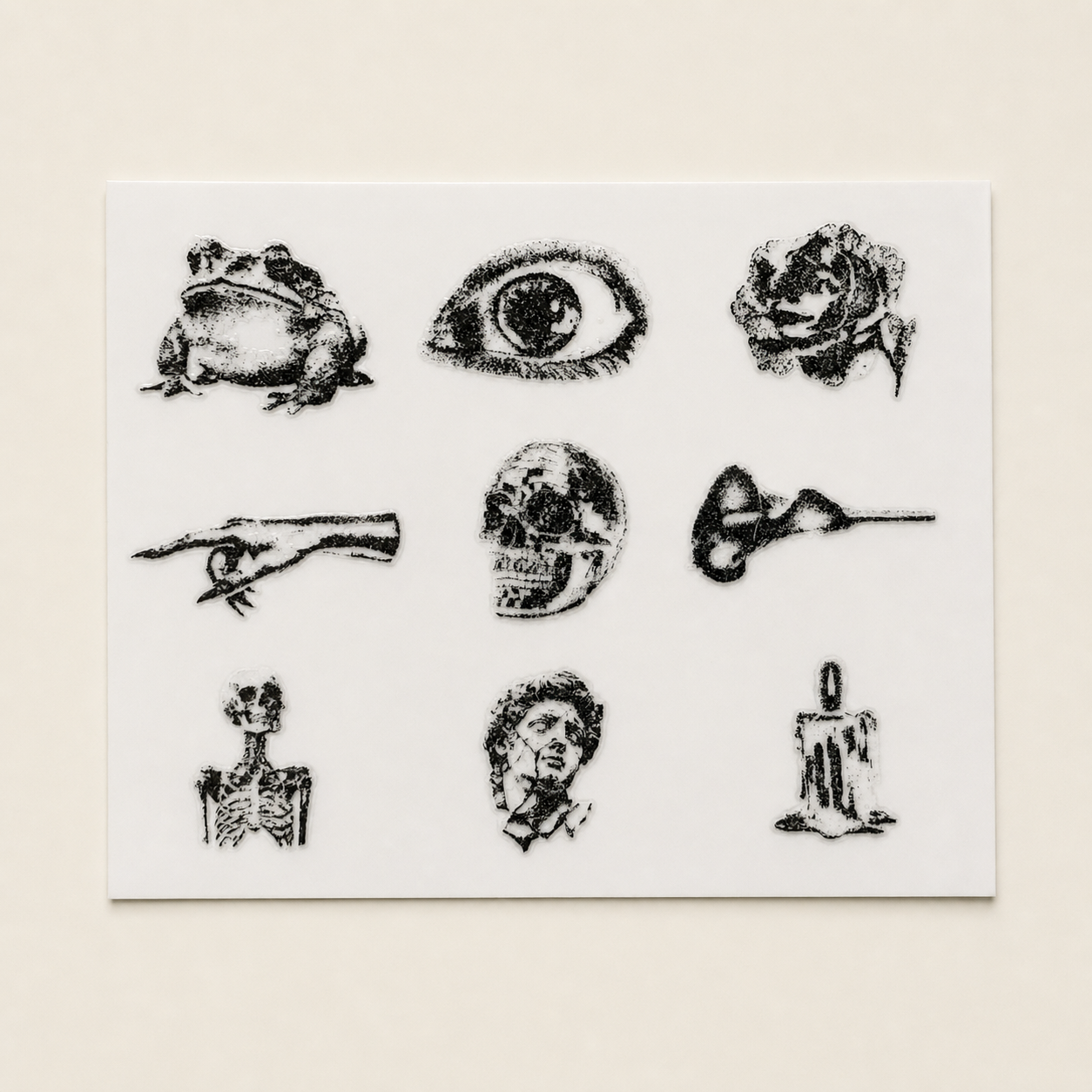 The Cabinet of Curiosities — Sheet 2: toad, eye, rose, pointing hand, skull, reclining figure, skeleton, classical bust, candle